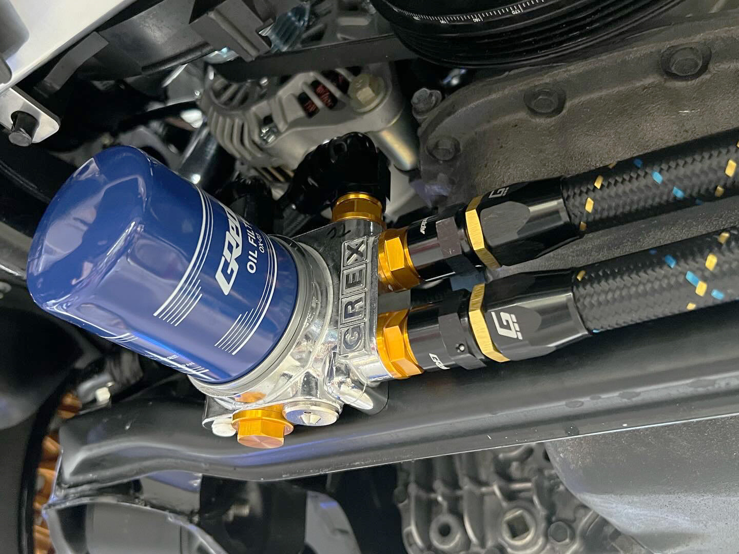 GReddy AN10 Straight Swivel Hose End - Black/Gold Anodized