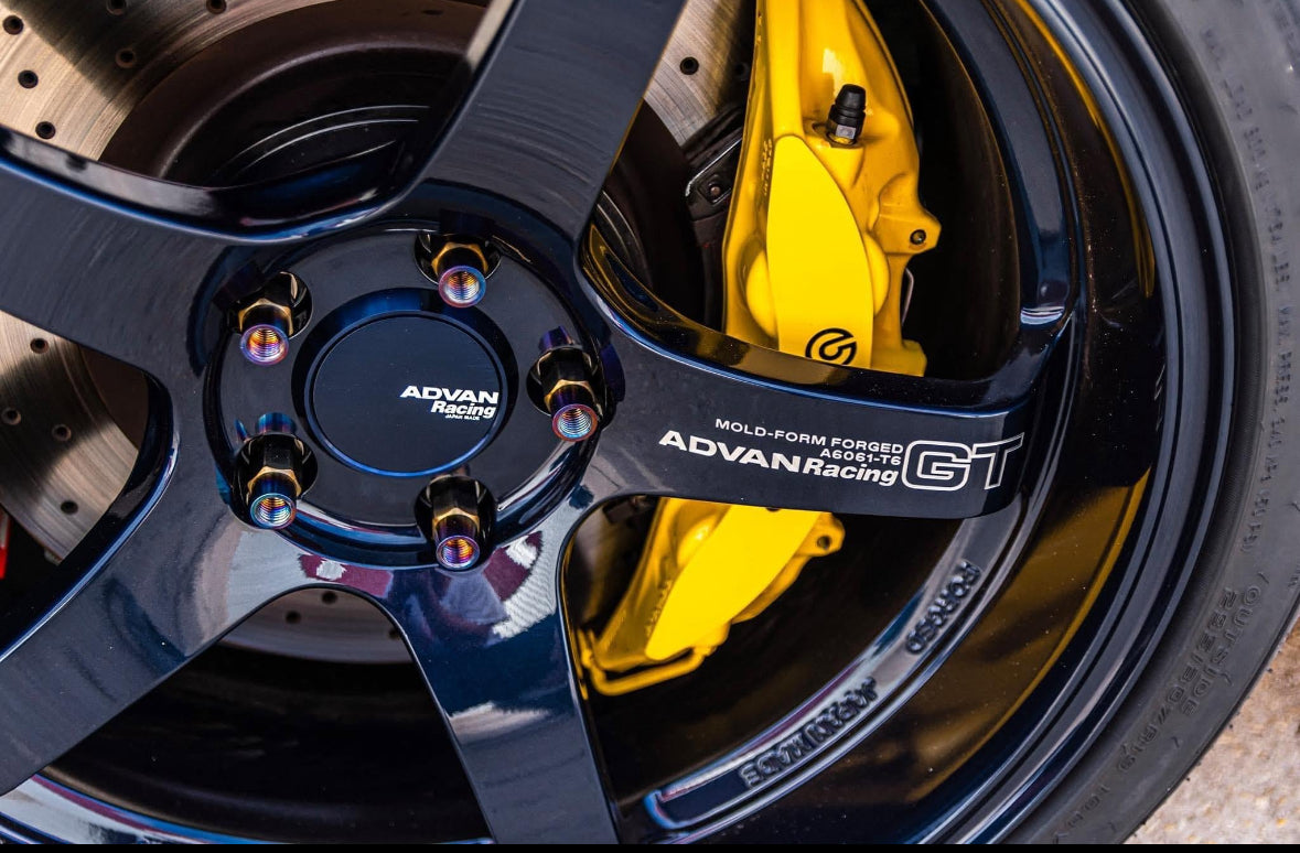 DM-style 18–19″ alloy wheels in 5×114.3 and 5×100 bolt patterns, showcased in a staggered fit on J‑Spec Garage wheel collection page